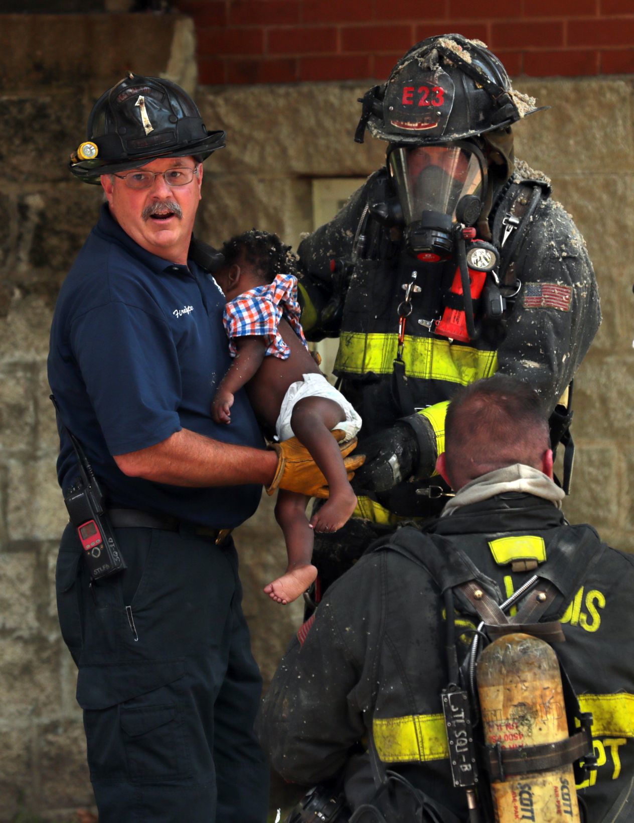 Firefighters rescue four children from burning apartment